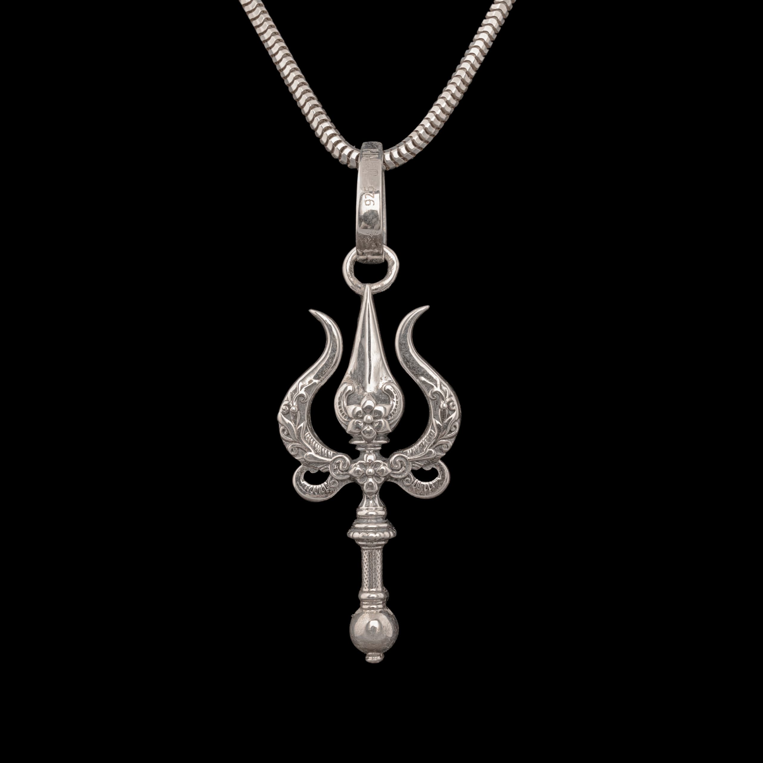 Silver trishul pendant with a skull worked into the join